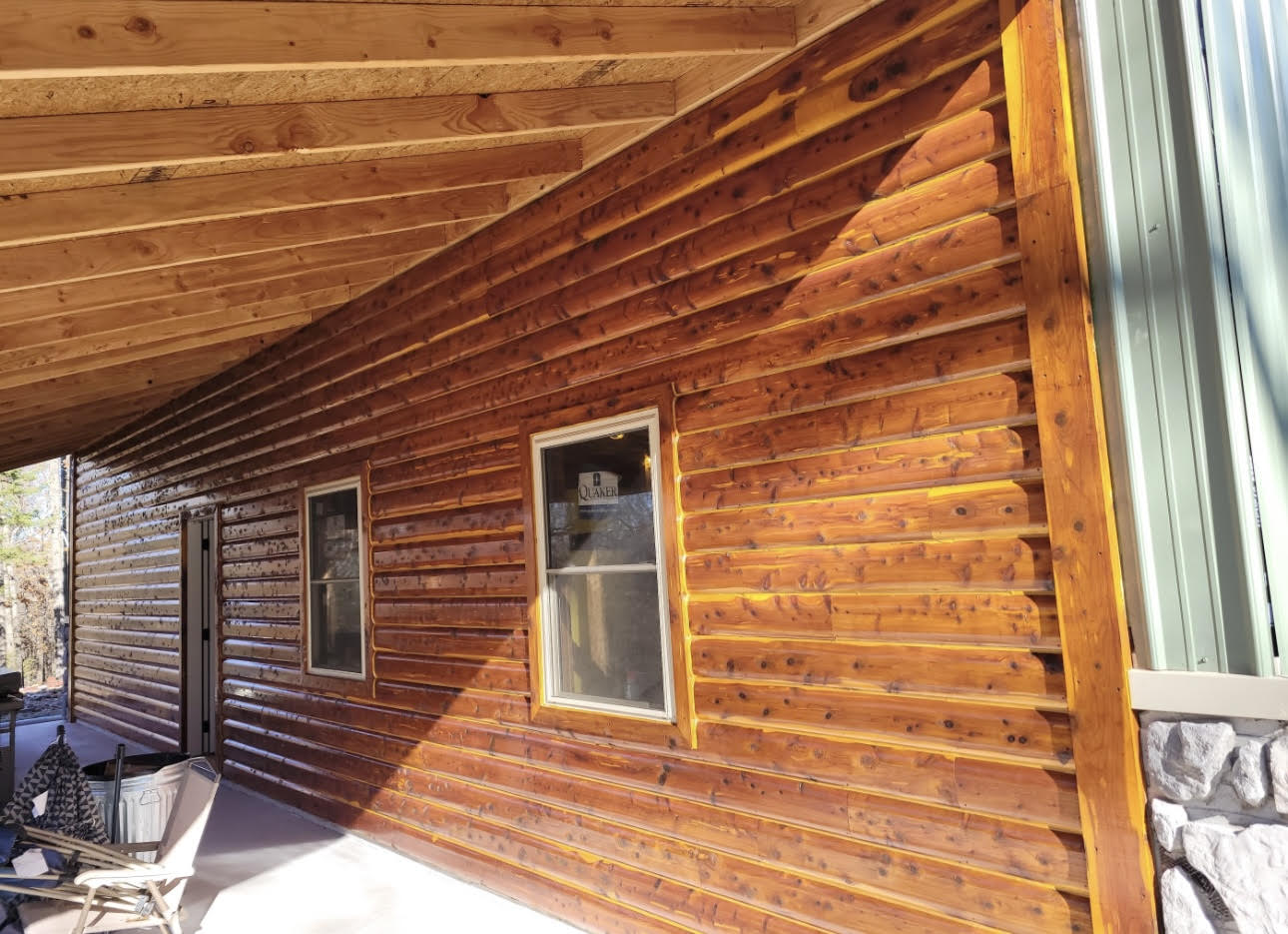Metal building with cedar log porch 3